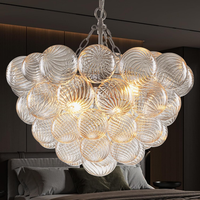 Bubble Glass Chandelier, 9-Light Ribbed Globe Shade, Black and Clear, 32"